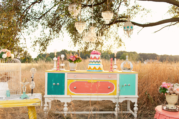 Colorful, vintage inspired chest with eclectic decor and wedding cake - Photo by Studio 6.23